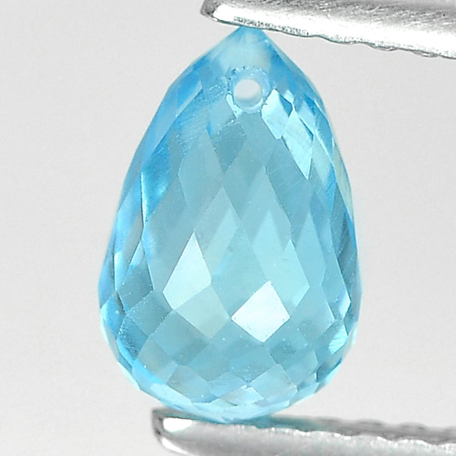 Natural Swiss Blue Topaz 1.67 Ct. Briolette with Drilled 7.8 x 5 Mm. Gemstone From Brazil: Product ID: 807164603 Product Name: Natural Blue Topaz Weight: 1.67 CT. Size: 7.8 x 5 x 5 MM. Shape: Briolette with Drilled Color: Blue Clarity:VSI Luster: Good Gems Origin: Brazil Treatment: Treated 