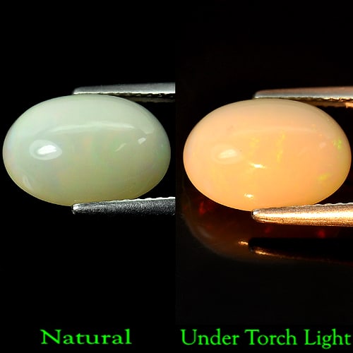 Natural Multi Color Opal 3.63 Ct. Oval Cabochon Shape 12.8 x 9.1 Mm Gemstone from Ethiopia: Product ID: 818708070 Product Name: Natural Opal Weight: 3.63 CT. Size: 12.8 x 9.1 x 6 MM. Shape: Oval Cabochon Color: Multi Color Clarity:Semi - Transparent Luster: Good Gems Origin: Ethiopia Treatme