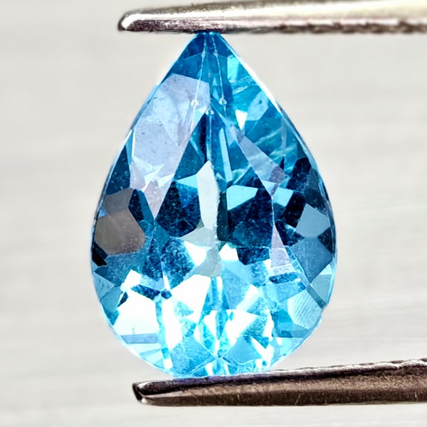 Natural Swiss Blue Topaz 2.00 Ct. Pear Shape 9.9 x 7 Mm Gemstone From Brazil: Product ID: 807168017 Product Name: Natural Blue Topaz Weight: 2.00 CT. Size: 9.9 x 7 x 4.7 MM. Shape: Pear Shape Color: Swiss Blue Clarity:VSI - SI1 Luster: Good Gems Origin: Brazil Treatment: Treate