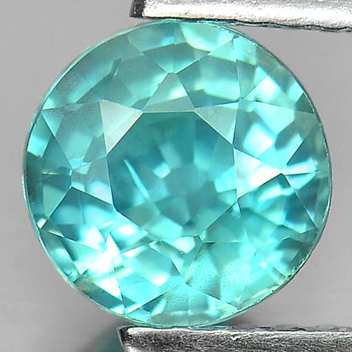 Natural Blue Zircon 1.75 Ct. Round Shape 6.6 Mm.Gemsotne From Cambodia: Product ID: 807726986 Product Name: Natural Zircon Weight: 1.75 CT. Size: 6.6 x 6.6 x 4.2 MM. Shape: Round Color: Blue Clarity:VSI Luster: Good Gems Origin: Cambodia Treatment: Heated Crystal Structur