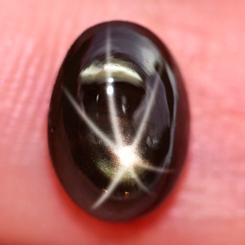 Natural Black Star Sapphire 6 Rays 1.91 Ct. Oval Cabochon Shape 8 x 5.8 Mm. Gemstone: Product ID: 806135458 Product Name: Natural Star Sapphire Weight: 1.91 CT. Size: 8 x 5.8 x 3.9 MM. Shape: Oval Cabochon Color: Black Clarity:Opaque Luster: Good 6 Rays Star Gems Origin: Thailand Treat