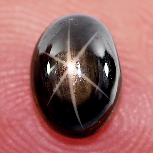 Natural Black Star Sapphire 6 Rays 1.90 Ct. Oval Cabochon Shape 7.5 x 5.7 Mm. Gemstone: Product ID: 806139258 Product Name: Natural Star Sapphire Weight: 1.90 CT. Size: 7.5 x 5.7 x 4 MM. Shape: Oval Cabochon Color: Black Clarity:Opaque Luster: Good 6 Rays Star Gems Origin: Thailand Treat
