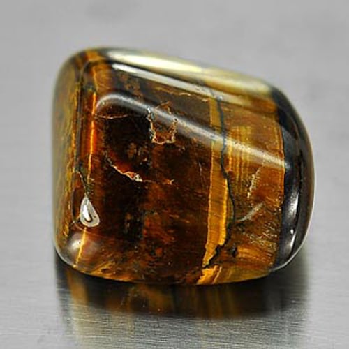 Natural Tiger Eye Agate 20.71 Ct. Fancy Cabochon Shape Unheated Gemstone: Product ID: 860000650 Product Name: Natural Agate Weight: 20.71 CT. Size: 16.2 x 5.3 x 9.5 MM. Shape: Fancy Cabochon Color: Multi-Color Clarity:Opaque Luster: Good Gems Origin: Madagascar Treatment: U