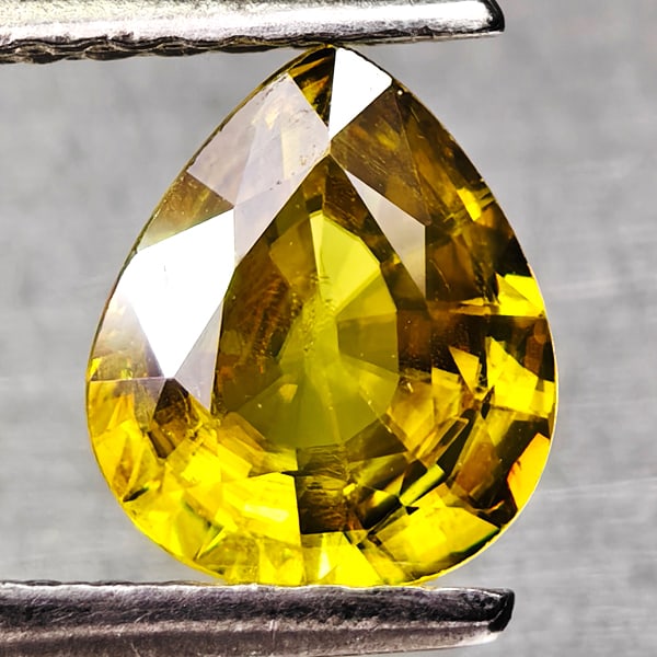 Natural Green Titanium Sphene With Rainbow Spark 0.82 Ct. Pear Shape 6.7 x 5.8 Mm Gemstone From: Product ID: 806509042 Product Name: Natural Sphene Weight: 0.82 CT. Size: 6.7 x 5.8 x 3 MM. Shape: Pear Shape Color: Yellow Green With Rainbow Spark Clarity:SI1 Luster: Good Gems Origin: Madagascar Tr