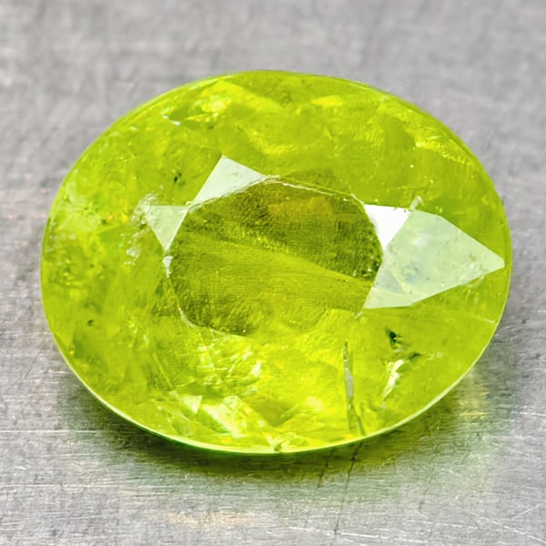 Natural Sphene Intense Yellow Green Titanium Red Spark 0.74 Ct. Oval Shape 6.1 x 5 Mm Gemstone From: Product ID: 806509018 Product Name: Natural Sphene Weight: 0.74 CT. Size: 6.1 x 5 x 3 MM. Shape: Oval Shape Color: Intense Yellow Green With Red Spark Clarity:SI1 Luster: Good Gems Origin: Madagascar 