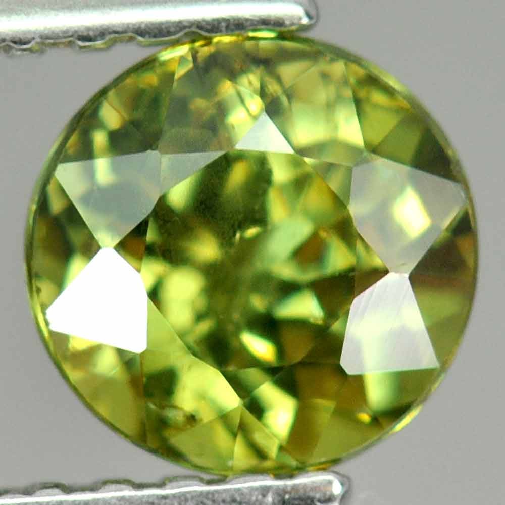 Natural Green Demantoid Garnet 1.00 Ct. Round Shape 5.6 Mm. Gemstone From Madagascar: Product ID: 802921494 Product Name: Natural Demantoid Weight: 1.01 CT. Size: 5.6 x 5.6 x 4 MM. Shape: Round Color: Green Clarity:SI Luster: Very Good Gems Origin: Madagascar , Africa Treatment: Unheat