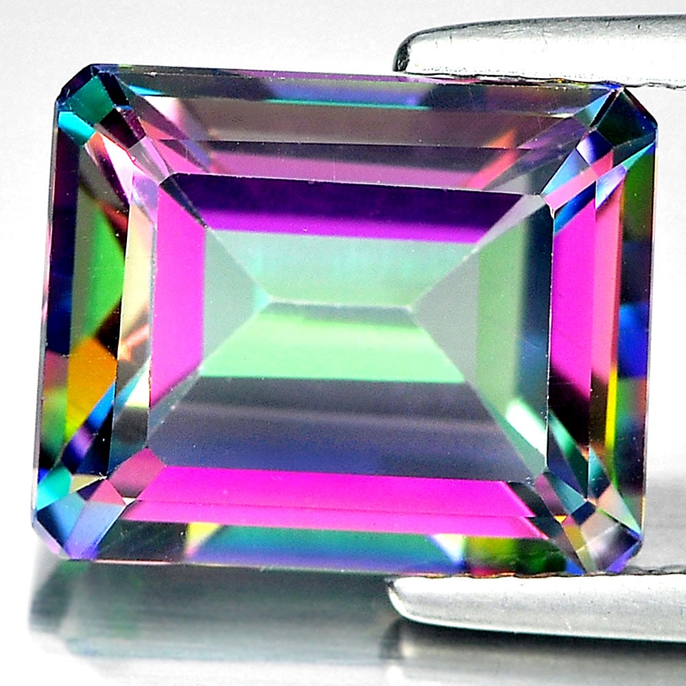 Natural Mystic Green Topaz 5.70 Ct. VVS Octagon Shape 11 x 9 Mm. Gemstone From Brazil: Product ID: 807138909 Product Name: Natural Topaz Weight: 5.70 CT. Size: 11 x 9 x 5.9 MM. Shape: Octagon Color: Mystic Clarity:VVS Luster: Good Gems Origin: Brazil Treatment: Treated Crystal Structure