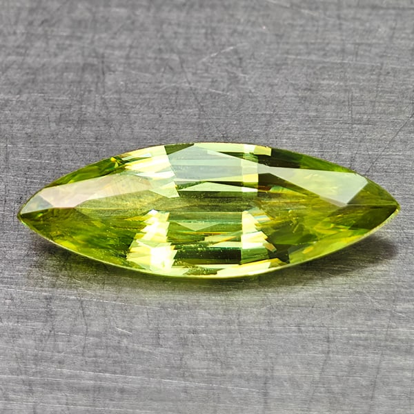 Natural Green Sphene With Rainbow Spark 0.79 Ct. Marquise Shape 11.6 x 4.1 Mm Gemstone: Product ID: 806509041 Product Name: Natural Sphene Weight: 0.79 CT. Size: 11.6 x 4.1 x 2.1 MM. Shape: Marquise Shape Color: Yellow Green With Rainbow Spark Clarity:SI1 Luster: Good Gems Origin: Madaga
