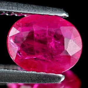 Natural Purplish Pink Ruby 0.91 Ct. Oval Shape 7.1 x 5.3 Mm. Unheated Gemstone From Tanzania: Product ID: 805927006 Product Name: Natural Ruby Weight: 0.91 CT. Size: 7.1 x 5.3 x 2.3 MM. Shape: Oval Color: Purplish Pink Clarity:VSI Luster: Good Gems Origin: Tanzania Treatment: Unheated Crystal