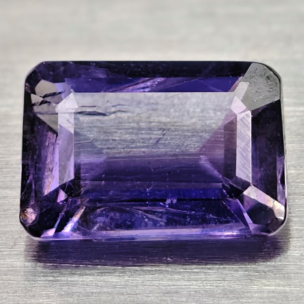 Natural Violet Iolite 0.74 Ct. Octagon Shape 6.8 x 4.7 Mm Gemstone From Madagascar: Product ID: 103800269 Product Name: Natural Iolite Weight: 0.74 CT. Size: 6.8 x 4.7 x 3.2 MM. Shape: Octagon Color: Violet Clarity:SI Luster: Good Gems Origin: Madagascar Treatment: Unheated Crystal S