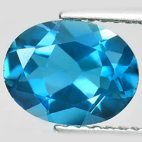 Natural London Blue Topaz 2.04 Ct. VVS Oval Shape 9 x 7 Mm. Gemstone From Brazil: Product ID: 807162026 Product Name: Natural Blue Topaz Weight: 2.04 CT. Size: 9 x 7 x 4.3 MM. Shape: Oval Color: London Blue Clarity:VVS Luster: Good Gems Origin: Brazil Treatment: Treated Crystal Str