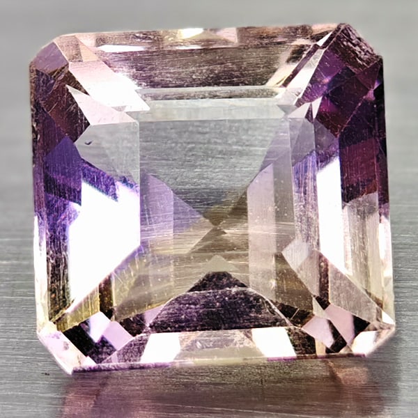 Natural Bi Color Ametrine 1.47 Ct. Clean Octagon Shape 6.8 x 6.7 Mm Gemstone from Brazil: Product ID: 100401972 Product Name: Natural Ametrine Weight: 1.47 CT. Size: 6.8 x 6.7 x 4.5 MM. Shape: Octagon Color: Bi Color Clarity:IF Luster: Good Gems Origin: Brazil Treatment: Unheated Crystal S