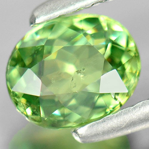 Natural Green Demantoid Garnet 0.76 Ct. Oval Shape 6.3 x 5.1 Mm. Gemstone From Madagascar: Product ID: 802922057 Product Name: Natural Demantoid Weight: 0.76 CT. Size: 6.3 x 5.1 x 2.8 MM. Shape: Oval Color: Green Clarity:SI Luster: Very Good Gems Origin: Mardagascar Treatment: Unheated Crys