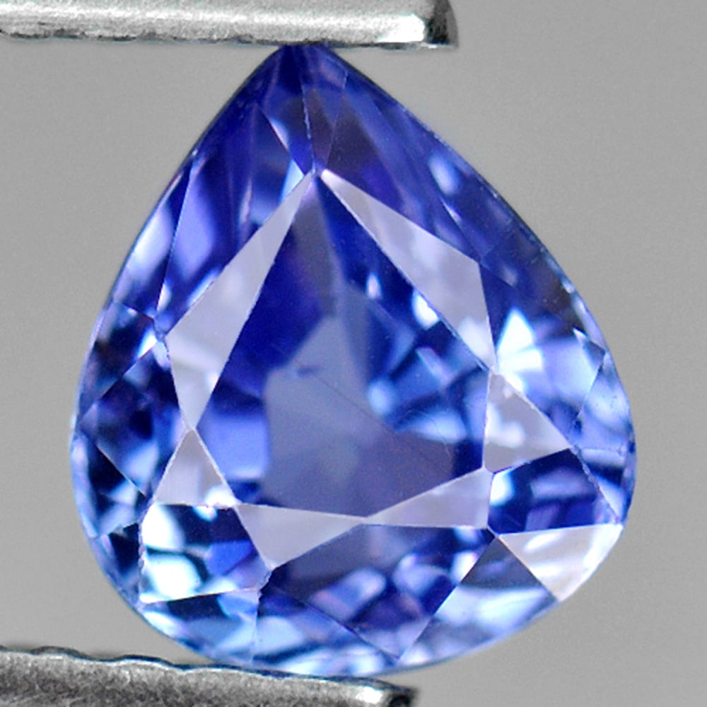 Natural Violetish Blue Tanzanite 1.01 Ct. Pear Shape 6.4 x 5.6 Mm Gemstone From Tanzania: Product ID: 807009257 Product Name: Natural Tanzanite Weight: 1.01 CT. Size: 6.4 x 5.6 x 4.3 MM. Shape: Pear Color: Violetish Blue Clarity:VSI Luster: Good Gems Origin: Tanzania Treatment: Heated Crys