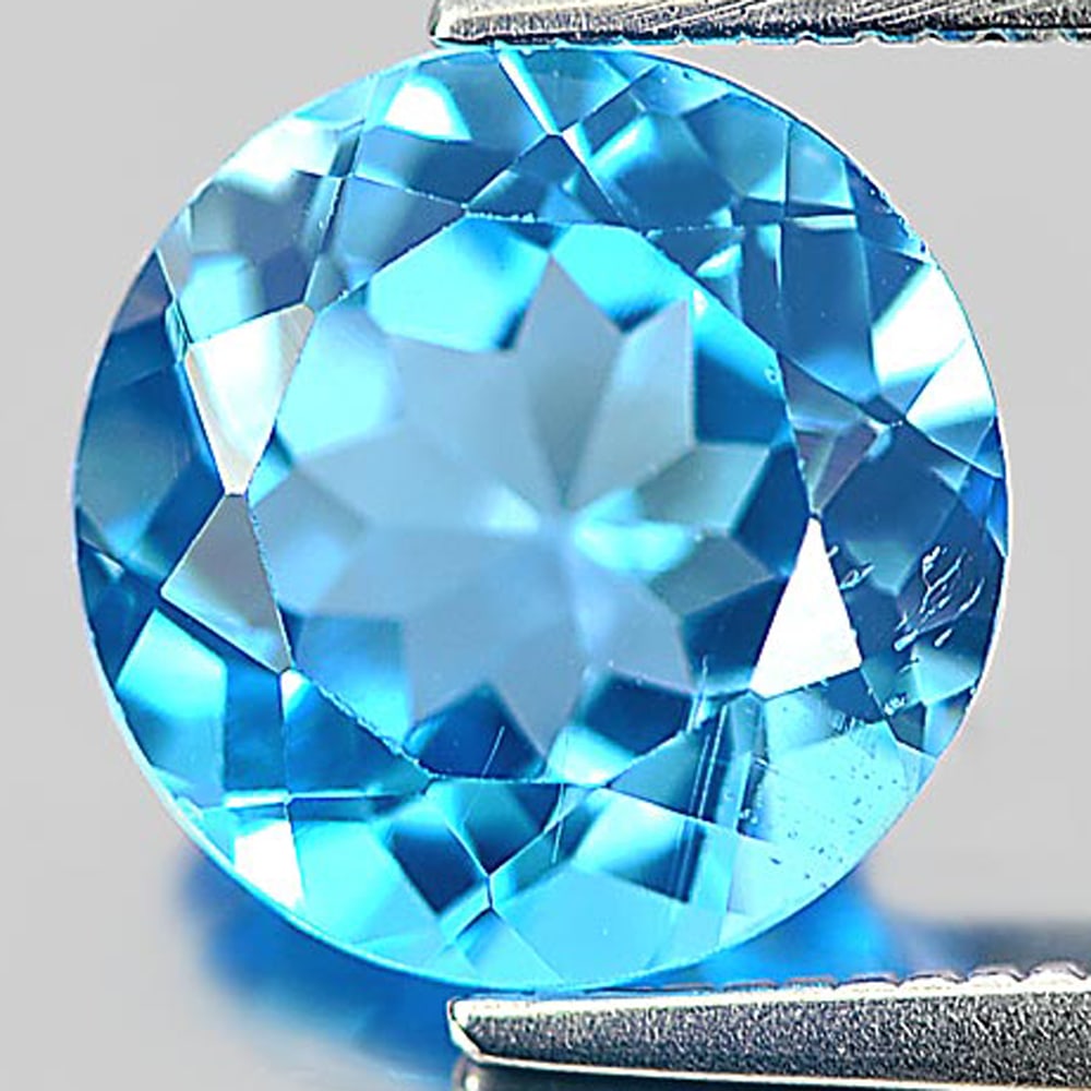 Natural Swiss Blue Topaz 3.32 Ct. Round Shape 9.2 Mm Gemstone From Brazil: Product ID: 807155907 Product Name: Natural Blue Topaz Weight: 3.32 CT. Size: 9.2 x 9.2 x 5.6 MM. Shape: Round Color: Swiss Blue Clarity:VSI Luster: Good Gems Origin: Brazil Treatment: Treated Crystal