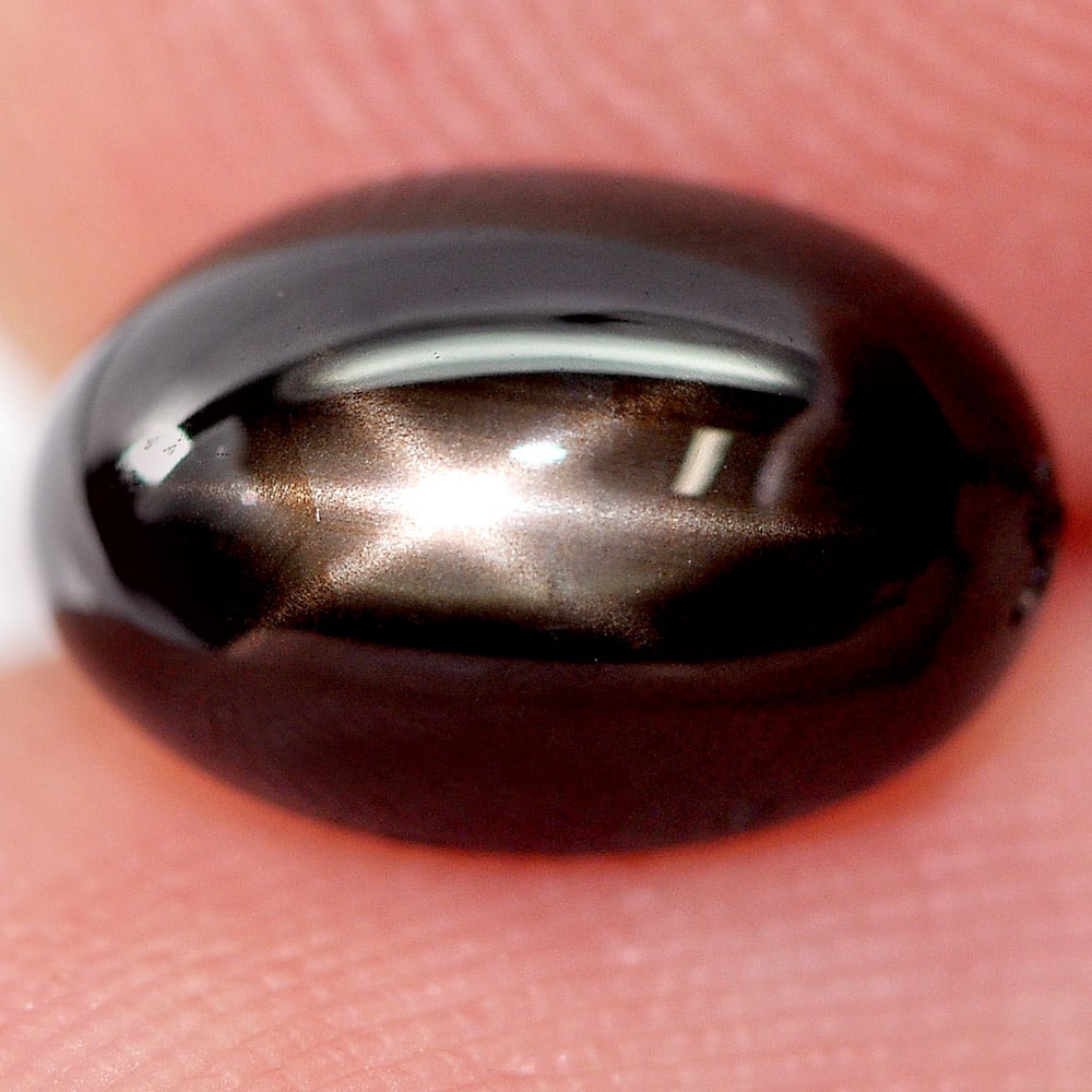 Natural Black Star Sapphire 6 Rays 2.56 Ct. Oval Cabochon Shape 8.8 x 6 Mm. Gemstone From Thailand: Product ID: 806161647 Product Name: Natural Star Sapphire Weight: 2.56 CT. Size: 8.8 x 6 x 4.5 MM. Shape: Oval Cabochon Color: Black Clarity:Opaque Luster: Good 6 Rays Star Gems Origin: Thailand Treat