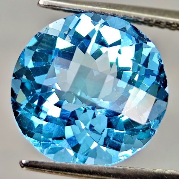 Natural Swiss Blue Topaz 6.88 Ct. Round Checkerboard Cut 11.9 Mm Gemstone From Brazil: Product ID: 807167916 Product Name: Natural Blue Topaz Weight: 6.88 CT. Size: 11.9 x 11.9 x 7.6 MM. Shape: Round Checkerboard Cut Color: Swiss Blue Clarity:VSI Luster: Good Gems Origin: Brazil Treatme