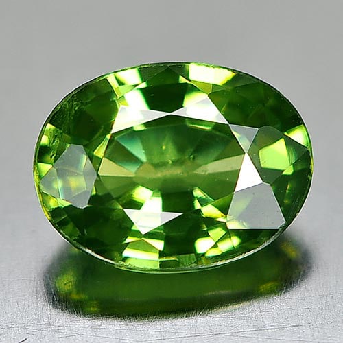 Natural Green Demantoid Garnet 1.00 Ct. Oval Shape 6.9 x 5.2 x 3.1 Mm. Unheated Gemstone: Product ID: 802929782 Product Name: Natural Demantoid Weight: 1.00 CT. Size: 6.9 x 5.2 x 3.1 MM. Shape: Oval Color: Green Clarity:VSI Luster: Very Good Gems Origin: Madagascar Treatment: Unheated Crys