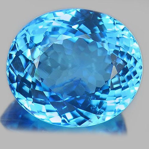 Natural Swiss Blue Topaz 19.67 Ct. Clean Oval Shape 16.6 x 14.4 Mm. Gemstone From Brazil: Product ID: 807164096 Product Name: Natural Blue Topaz Weight: 19.67 CT. Size: 16.6 x 14.4 x 10.4 MM. Shape: Oval Color: Blue Clarity:IF Luster: Very Good Gems Origin: Brazil Treatment: Treated Crysta