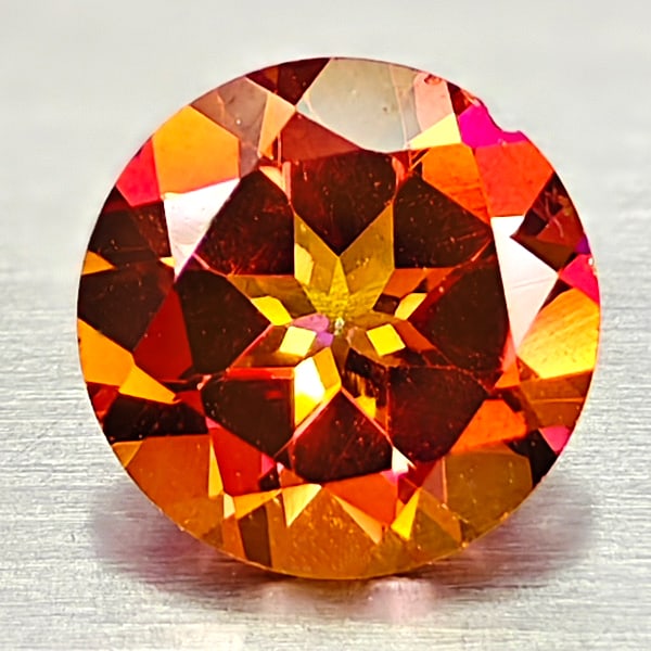Natural Cracking Fire Color Topaz 0.96 Ct. Round Shape 6.1 Mm Gemstone From Brazil: Product ID: 807167842 Product Name: Natural Topaz Weight: 0.96 CT. Size: 6.1 x 6.1 x 3.8 MM. Shape: Round Color: Cracking Fire Clarity:IF Luster: Very Good Gems Origin: Brazil Treatment: Treated Cryst