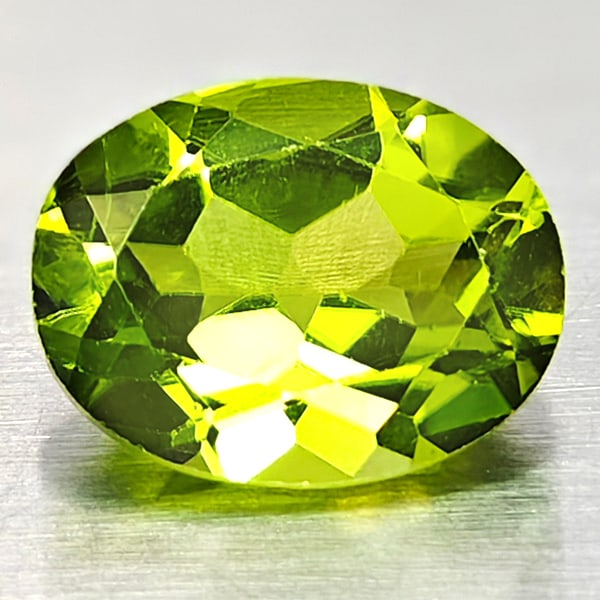 Natural Green Peridot 2.33 Ct. Oval Shape 7 x 9 Mm. Gemstone From Pakistan: Product ID: 805316946 Product Name: Natural Peridot Weight: 2.33 CT. Size: 7 x 9 x 4.8 MM. Shape: Oval Color: Green Clarity:VSI Luster: Good Gems Origin: Pakistan Treatment: Unheated Crystal Structure