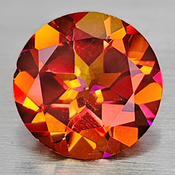 Natural Cracking Fire Color Topaz 0.91 Ct. Clean Round Shape 6.1 Mm Gemstone From Brazil: Product ID: 807167835 Product Name: Natural Topaz Weight: 0.91 CT. Size: 6.1 x 6.1 x 3.6 MM. Shape: Round Color: Cracking Fire Clarity:IF Luster: Very Good Gems Origin: Brazil Treatment: Treated Cryst