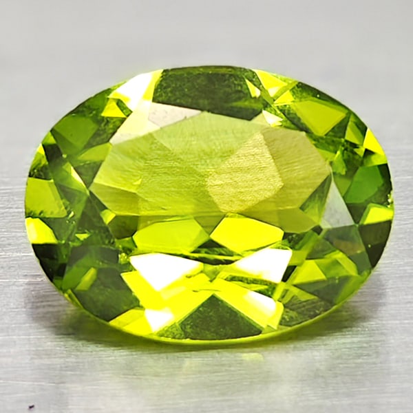 Natural Green Peridot 1.86 Ct. Oval Shape 7 x 9.1 Mm. Gemstone From Pakistan: Product ID: 805316935 Product Name: Natural Peridot Weight: 1.86 CT. Size: 7 x 9.1 x 4 MM. Shape: Oval Color: Green Clarity:VSI Luster: Good Gems Origin: Pakistan Treatment: Unheated Crystal Structure