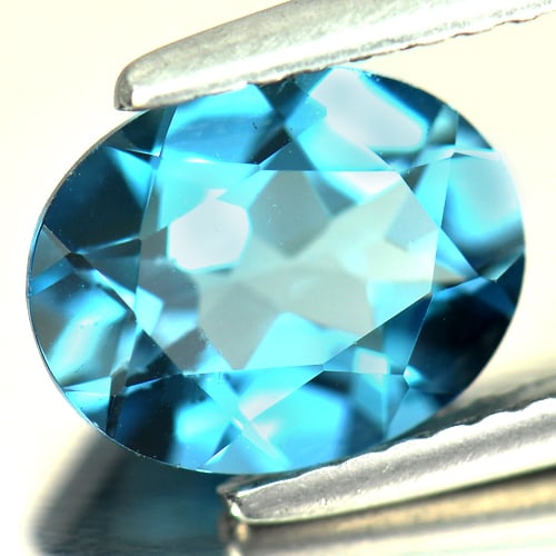 Natural London Blue Topaz 2.09 Ct. Oval Shape 9 x 7 Mm Gemstone From Brazil: Product ID: 807161041 Product Name: Natural Blue Topaz Weight: 2.09 CT. Size: 9 x 7 x 4.3 MM. Shape: Oval Color: London Blue Clarity:VSI Luster: Good Gems Origin: Brazil Treatment: Treated Crystal Str
