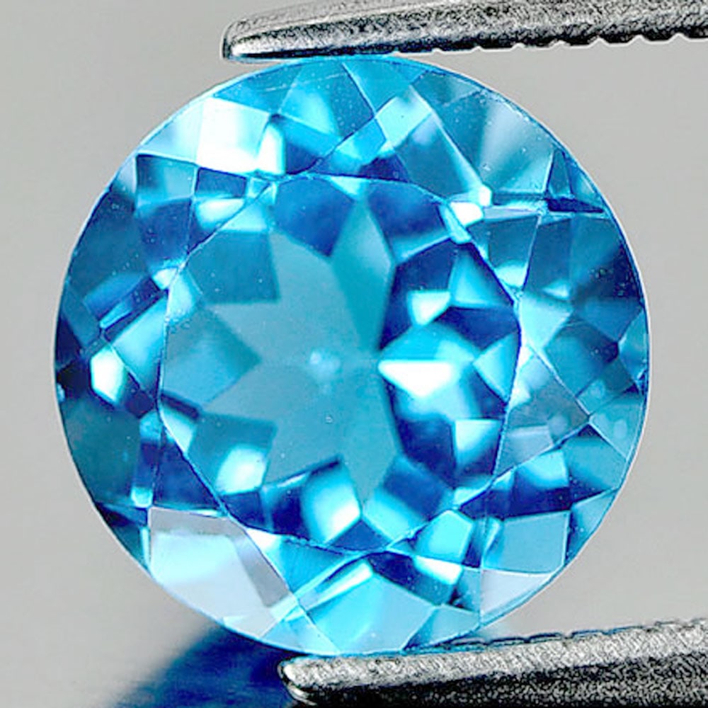 Natural Swiss Blue Topaz 3.18 Ct. Clean Round Shape Size 9 Mm. Gemstone From Brazil: Product ID: 807158439 Product Name: Natural Blue Topaz Weight: 3.18 CT. Size: 9 x 9 x 5.6 MM. Shape: Round Color: Swiss Blue Clarity:IF Luster: Very Good Gems Origin: Brazil Treatment: Treated Crystal