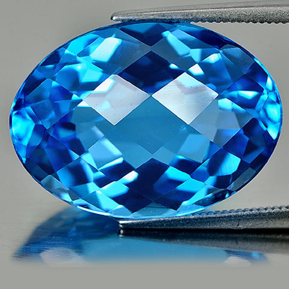 Natural Swiss Blue Topaz 29.19 Ct. Clean Oval Checkerboard Cut 22 x 16.3 Mm. Gemstone From Brazil: Product ID: 807158512 / Product Name: Natural Blue Topaz / Weight: 29.19 CT. / Size: 22 x 16.3 x 11 MM. / Shape: Oval Checkerboard / Color: Blue / Clarity:IF / Luster: Very Good / Gems Origin: Brazil