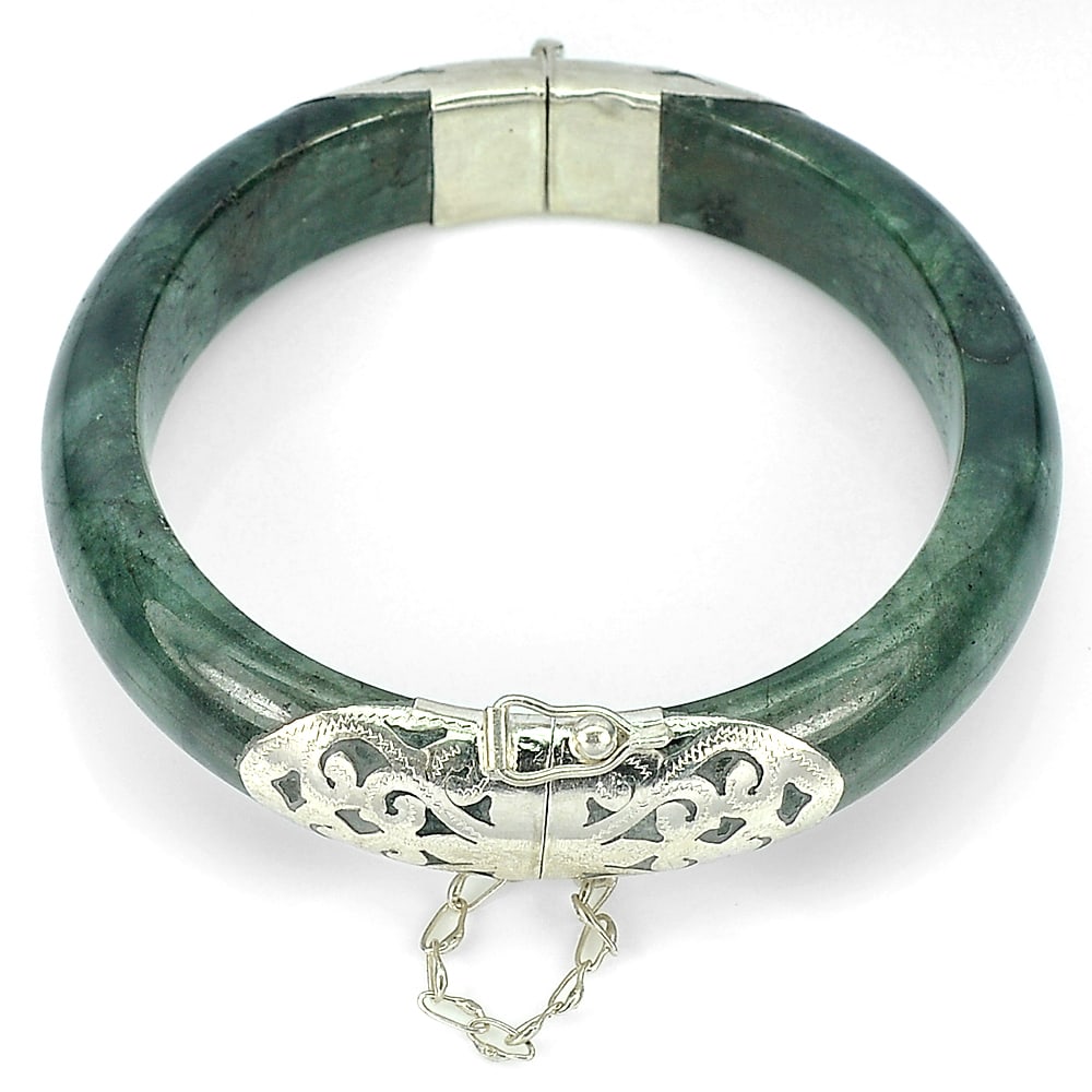 Natural Green Jade Bangle 353.08 Ct. with Silver Size 75 x 60 x 15 Mm.: Product ID: 819813164 Product Name: Natural Jade Weight: 353.09 CT. Size: 75 x 60 x 15 MM. Shape: Round Cabochon Color: Green Clarity:Opaque Luster: Good Gems Origin: Thailand Treatment: Unheated Crys