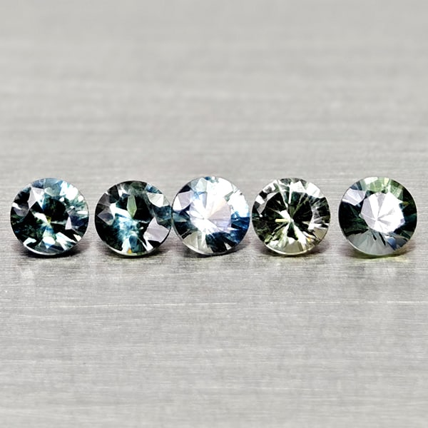 Natural Fancy Color Sapphire 0.81 Ct. 5 Pcs Round Diamand Cut 3.3 Mm Gemstones From Tanzania: Product ID: 806162171 Product Name: Natural Green Sapphire Weight: 0.81 CT. Size: 3.3 x 3.3 x 2.4 MM. Shape: Round Diamond Cut Color: Fancy Color Clarity:VSI Luster: Very Good Gems Origin: Tanzania Tr