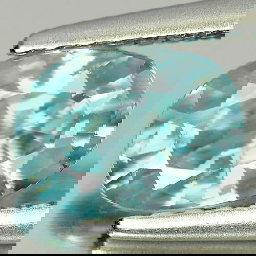 Natural Blue Zircon 1.24 Ct. Oval Shape Size 7 x 5 Mm. Gemstone From Cambodia: Product ID: 807717077 Product Name: Natural Zircon Weight: 1.24 CT. Size: 7 x 5 x 3.4 MM. Shape: Oval Color: Blue Clarity:VSI Luster: Good Gems Origin: Cambodia Treatment: Heated Crystal Structure: Te