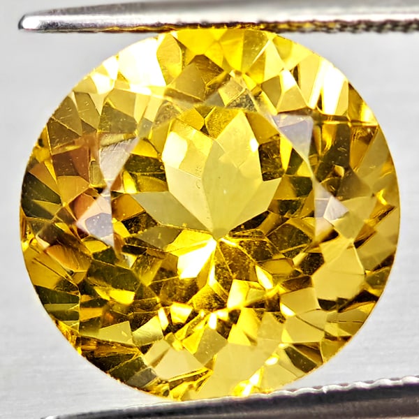 Natural Yellow Citrine 7.60 Ct. Round Shape 12.6 Mm Gemstone From Brazil: Product ID: 801815341 Product Name: Natural Citrine Weight: 7.60 CT. Size: 12.6 x 1.26 x 9.4 MM. Shape: Round Color: Yellow Clarity:VSI Luster: Good Gems Origin: Brazil Treatment: Unheated Crystal Str