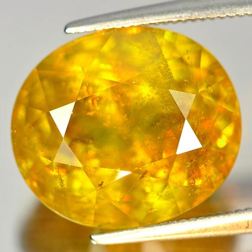 Natural Multi Color Titanium Sphene 13.35 Ct. Oval Shape 14.7 x 12.8 Mm. Unheated Gemstone (1 of 3)