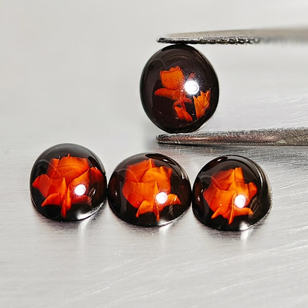 Natural Amber 2.10 Ct. Flower Carving In 4 Pcs. Oval Cabochon Shape 8.9 x 6.6 Mm Gemstones From: Product ID: 819091010 Product Name: Natural Amber Weight: 2.10 CT. Size: 8.9 x 6.6 x 3.5 MM. Shape: Oval Cabochon Color: Brown Yellow Clarity:Semi - Transparent Luster: Good Gems Origin: Poland Treatm