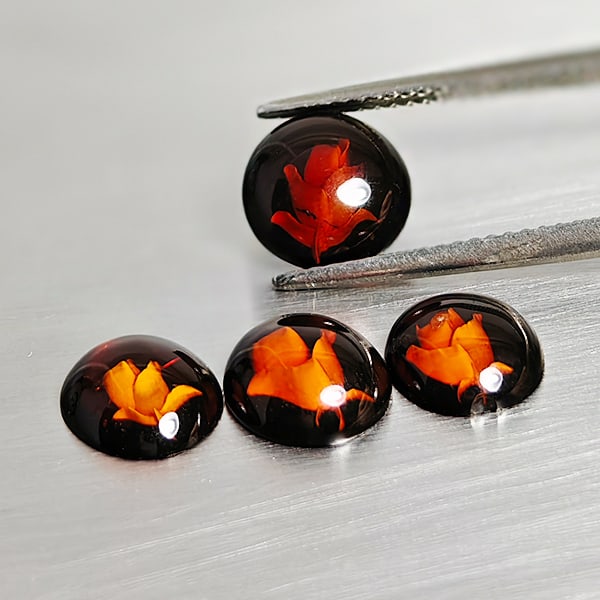 Natural Amber 2.39 Ct. 4 Pcs. Flower Carving In Oval Cabochon Shape 9 x 7.7 Mm Gemstones From Poland: Product ID: 819091007 Product Name: Natural Amber Weight: 2.39 CT. Size: 9 x 7.7 x 2.6 MM. Shape: Oval Cabochon Color: Brown Yellow Clarity:Semi - Transparent Luster: Good Gems Origin: Poland Treatmen