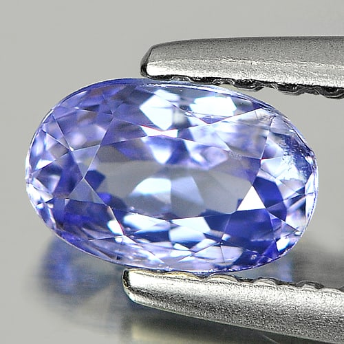 Violetish Blue Natural Tanzanite 0.58 Ct. Oval Shape 5.7 x 3.8 Mm. Gemstone From Tanzania: Product ID: 807008213 Product Name: Natural Tanzanite Weight: 0.58 CT. Size: 5.7 x 3.8 x 3.4 MM. Shape: Oval Color: Violetish Blue Clarity:SI Luster: Good Gems Origin: Tanzania Treatment: Heated Cryst