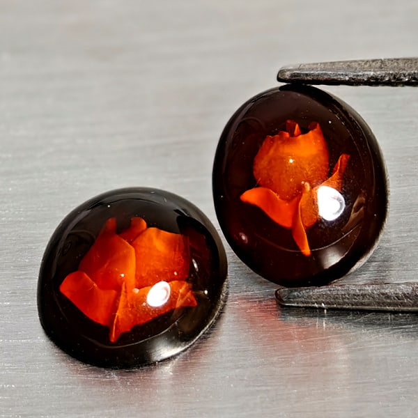 Natural Amber 1.42 Ct. 2 Pcs Flower Carving In Oval Cabochon 9.2 x 8 Mm Gemstones From Poland: Product ID: 819091071 Product Name: Natural Amber Weight: 1.42 CT. Size: 9.2 x 8 x 3.9 MM. Shape: Oval Cabochon Color: Brown Yellow Clarity:Semi - Transparent Luster: Good Gems Origin: Poland Treatmen