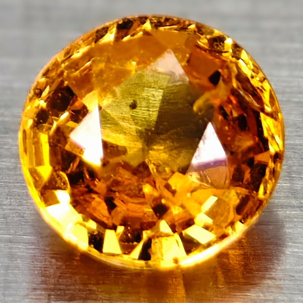 Natural Orange Spessartine Garnet 0.56 Ct. Round Shape 4.5 Mm Gemstone From Madagascar: Product ID: 102906949 Product Name: Natural Spessartine Weight: 0.56 CT. Size: 4.5 x 4.5 x 3 MM. Shape: Round Color: Yellow Orange Clarity:VSI Luster: Good Gems Origin: Madagascar Treatment: Unheated 