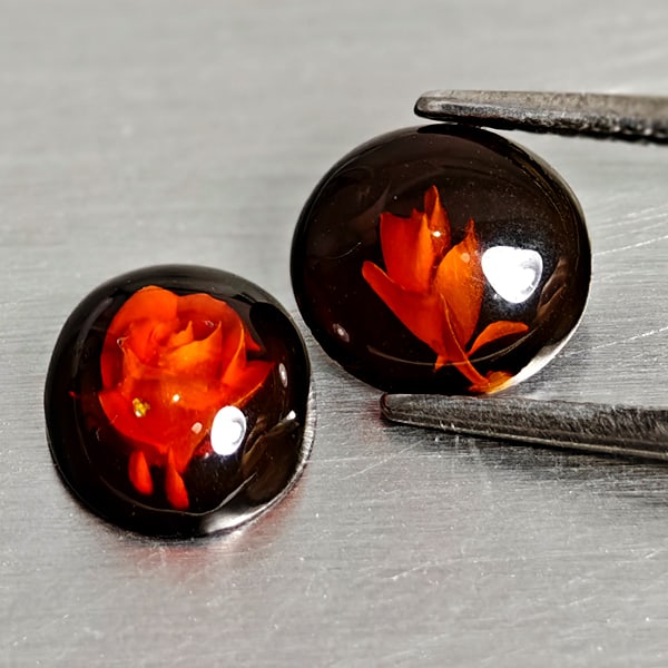 Natural Brown Yellow Amber 0.92 Ct. 2 Pcs Flower Carving In Oval Cabochon Gemstones From Poland: Product ID: 819091072 Product Name: Natural Amber Weight: 0.92 CT. Size: 8.7 x 7.2 x 3.2 to 8 x 7.5 x 2.3 MM. Shape: Oval Cabochon Color: Brown Yellow Clarity:Semi - Transparent Luster: Good Gems Orig