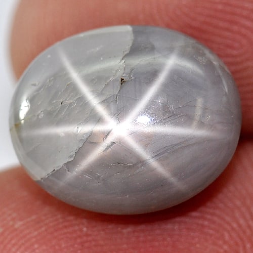 Natural Gray Star Sapphire 6 Rays 11.99 Ct. Oval Cabochon Shape 13.4 x 10.8 Mm Gemstone: Product ID: 806145479 Product Name: Natural Star Sapphire Weight: 11.99 CT. Size: 13.4 x 10.8 x 7.4 MM. Shape: Oval Cabochon Color: Gray Clarity:Opaque Luster: Good 6 Rays Star Gems Origin: Thailand T