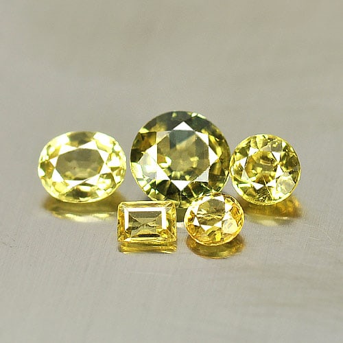 Natural Yellow Sapphire 1.46 Ct. Mix Shape 5 Pcs. Gemstone From Thailand: Product ID: 806152080 Product Name: Natural Yellow Sapphire Weight: 1.46 CT. Size: 3 x 2.2 x 1.2to5.2 x 5.2 x 2.6 MM. Shape: Mix Shape Color: Yellow Clarity:VSI Luster: Good Gems Origin: Thailand Trea