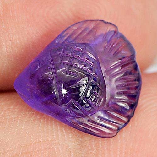 Natural Purple Amethyst Fish Carving 4.83 Ct. Unheated Gemstone From Brazil: Product ID: 810303841 Product Name: Natural Amethyst Weight: 4.83 CT. Size: 13.5 x 12.6 x 6.7 MM. Shape: Fish Carving Color: Purple Clarity:Semi - Transparent Luster: Good Gems Origin: Brazil Treatmen
