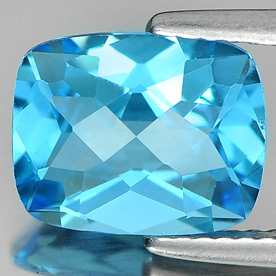 Natural Swiss Blue Topaz 3.34 Ct. Clean Cushion Checkerboard 10 x 8 Mm. Gemstone From Brazil: Product ID: 807166093 Product Name: Natural Blue Topaz Weight: 3.34 CT. Size: 10 x 8 x 5.2 MM. Shape: Cushion Checkerboard Color: Blue Clarity:IF Luster: Good Gems Origin: Brazil Treatment: Treated Cr