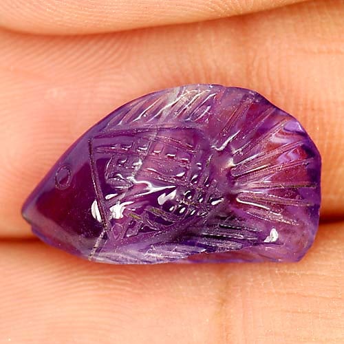 Natural Violet Amethyst 7.11 Ct. Fish Carving Size 18.5 x 10.6 Mm Gemstone From Brazil: Product ID: 810303444 Product Name: Natural Amethyst Weight: 7.11 CT. Size: 18.5 x 10.6 x 6.6 MM. Shape: Fish Carving Color: Violet Clarity:Semi - Transparent Luster: Good Gems Origin: Brazil Treatmen