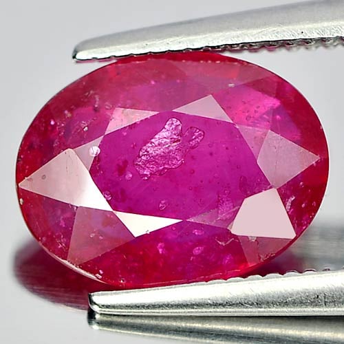 Natural Purplish Pink Ruby 2.57 Ct. Oval Shape 10 x 7.5 Mm. Gemstone From Mozambique: Product ID: 805920629 Product Name: Natural Ruby Weight: 2.57 CT. Size: 10 x 7.5 x 3.2 MM. Shape: Oval Color: Purplish Pink Clarity:VSI Luster: Good Gems Origin: Mozambique Treatment: Heated (Lead-gla