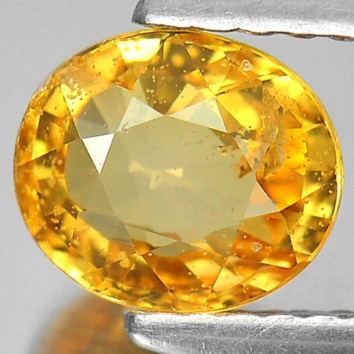 Natural Yellow Sapphire 1.17 Ct. Oval Shape 6.7 x 5.8 Mm. Gemstone From Thailand: Product ID: 806140009 Product Name: Natural Orange Sapphire Weight: 1.17 CT. Size: 6.7 x 5.8 x 3.3 MM. Shape: Oval Color: Yellow Clarity:SI Luster: Good Gems Origin: Thailand Treatment: Heated Crystal