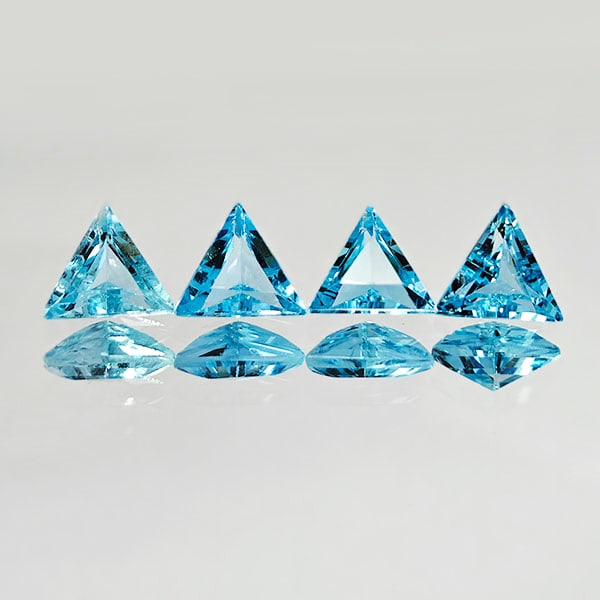 Natural Swiss Blue Topaz 2.03 Ct. 4 Pcs. Trilliant Shape 5.5 x 5.5 Mm. Gemstones from Brazil: Product ID: 807167775 Product Name: Natural Blue Topaz Weight: 2.03 CT. Size: 5.5 x 5.5 x 3 MM. Shape: Trilliant Color: Blue Clarity:VVS Luster: Good Gems Origin: Brazil Treatment: Treated Crystal Str