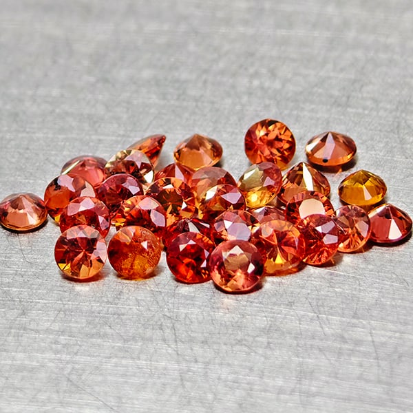 Natural Orange Red Songea Sapphire 2.28 Ct. 29 Pcs Round Diamond Cut 2.4 Mm. Gemstones From Tanzania: Product ID: 806162044 Product Name: Natural Red Sapphire Weight: 2.28 CT. Size: 2.4 x 2.4 x 1.6 MM. Shape: Round Diamond Cut Color: Red Orange Clarity:VSI Luster: Good Gems Origin: Tanzania Treatment: